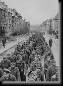 The endless procession of German prisoners * The endless procession of German prisoners captured with the fall of Aachen marching through the ruined city streets to captivity.Germany, October 1944 * 1055 x 1454 * (300KB)
